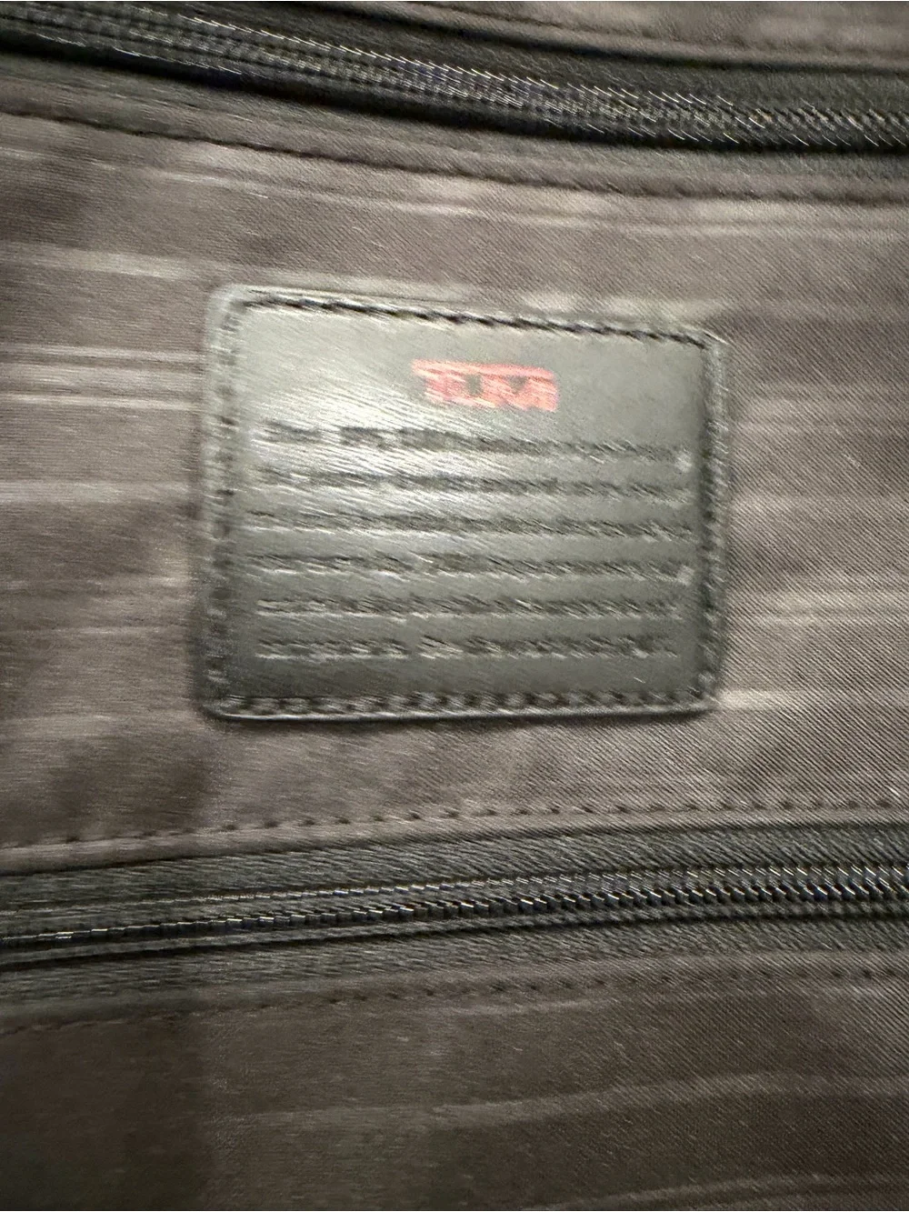 Tumi Navy Softside Carry-On Spinner